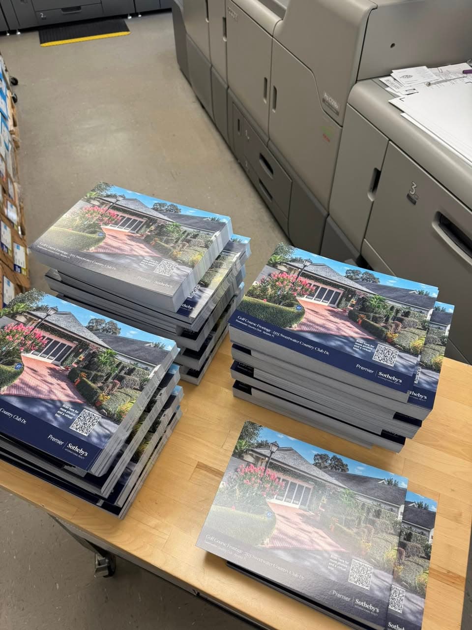 Ranger Printing press room with multiple digital presses and brochure stacks